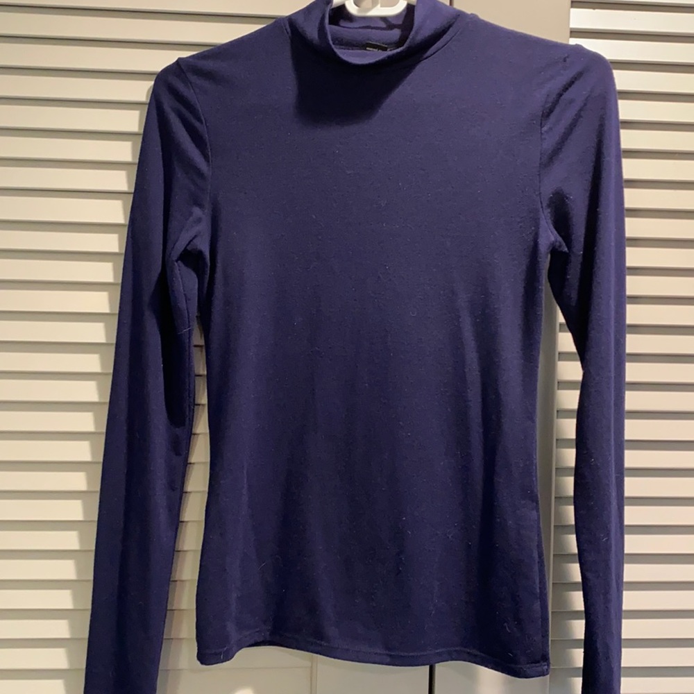 Navy blue sweater with a high neck